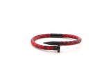 A red leather nail bangle with a black stainless steel nail head.