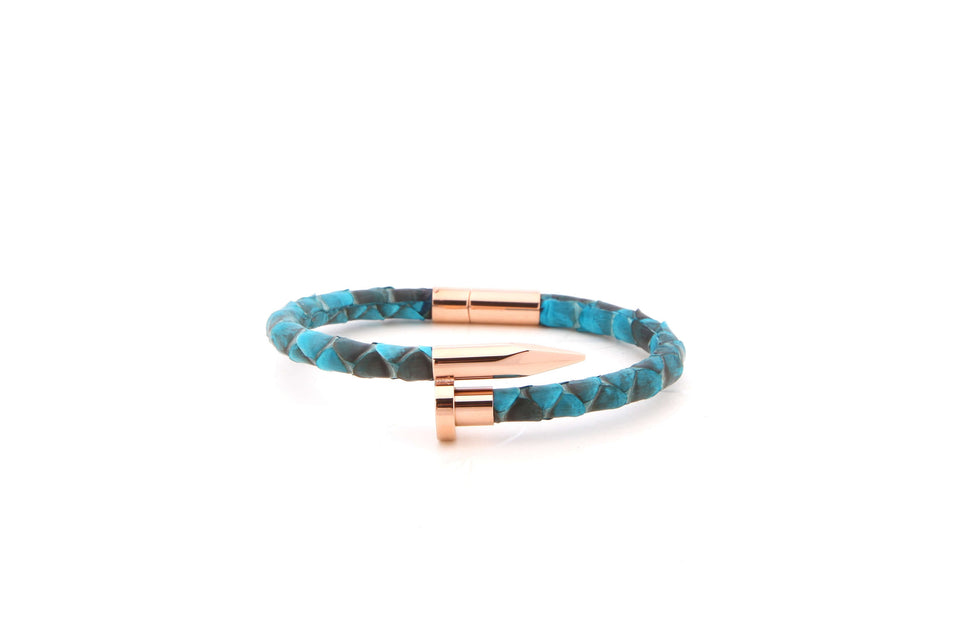 A bracelet with aqua-blue python leather and rose gold plated nail head.