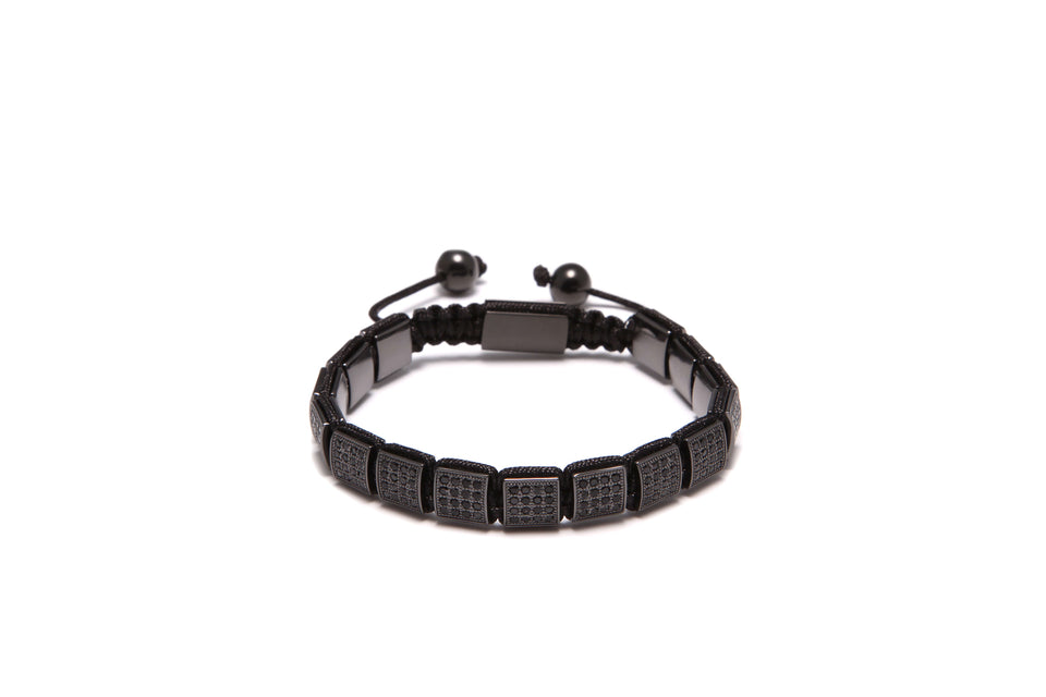 A black beaded bracelet with cubic zirconia diamonds arranged in a square pattern, with a stainless steel lock.