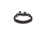 A black beaded bracelet with cubic zirconia diamonds arranged in a square pattern, with a stainless steel lock.