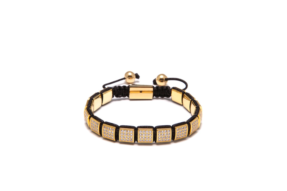 A gold-plated bracelet with black and yellow cubic zirconia diamond beads, with a stainless steel lock