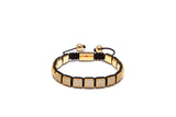 A gold-plated bracelet with black and yellow cubic zirconia diamond beads, with a stainless steel lock
