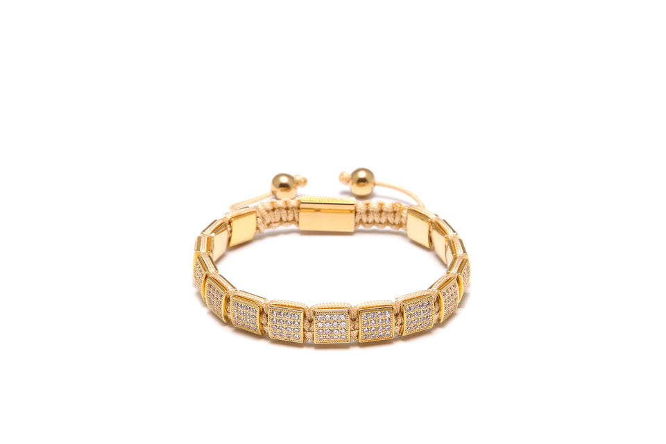 An 18K gold-plated bracelet with cubic zirconia diamond and small clear crystals, displayed against a white background.
