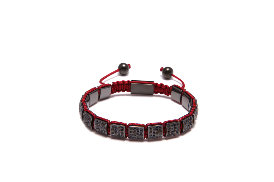 A black and red rope-style bracelet with square zirconia accents.