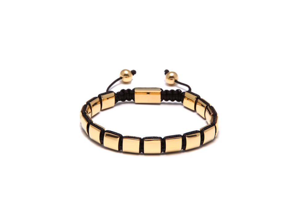 A gold square bracelet with black rope-style beads and gold-plated accents, displayed against a white background.