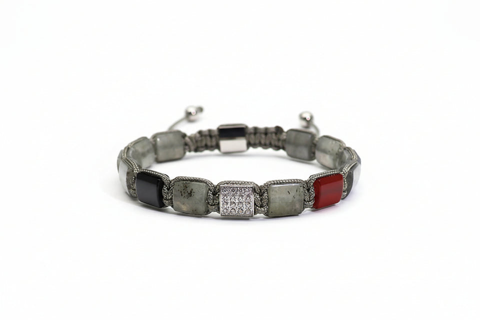 Bracelet with various colored stones on a white background